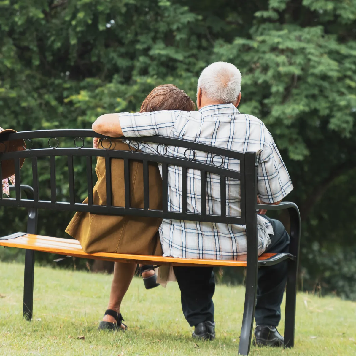 Could It Be Time for Memory Care Support Older couple sitting on a bench together